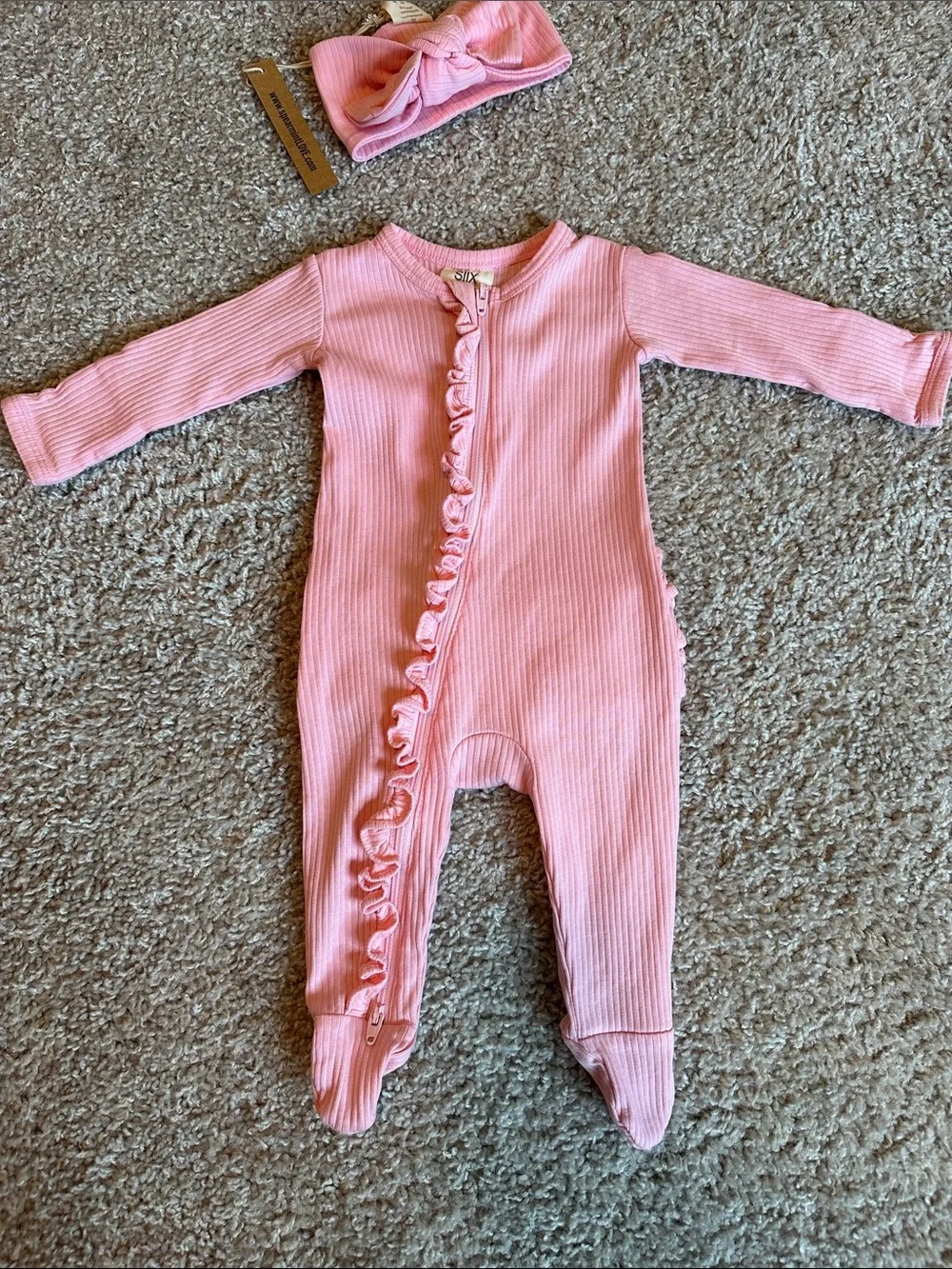 Pink organic ribbed frill zip footie with matching headband